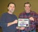 Robin Runyan receiving an award from president Mike Sharp at a club banquet